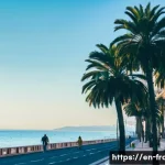 니스 해변과 프랑스 리비에라 여행 - **Promenade des Anglais Stroll:** A vibrant, sun-drenched scene on the Promenade des Anglais in Nice...